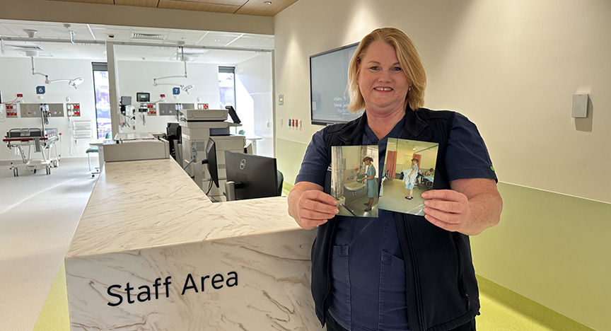 A healthcare worker in a staff area holds two photos of themselves in different settings.