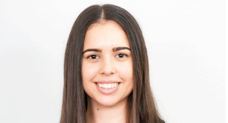 A person with long, straight brown hair against a plain white background.