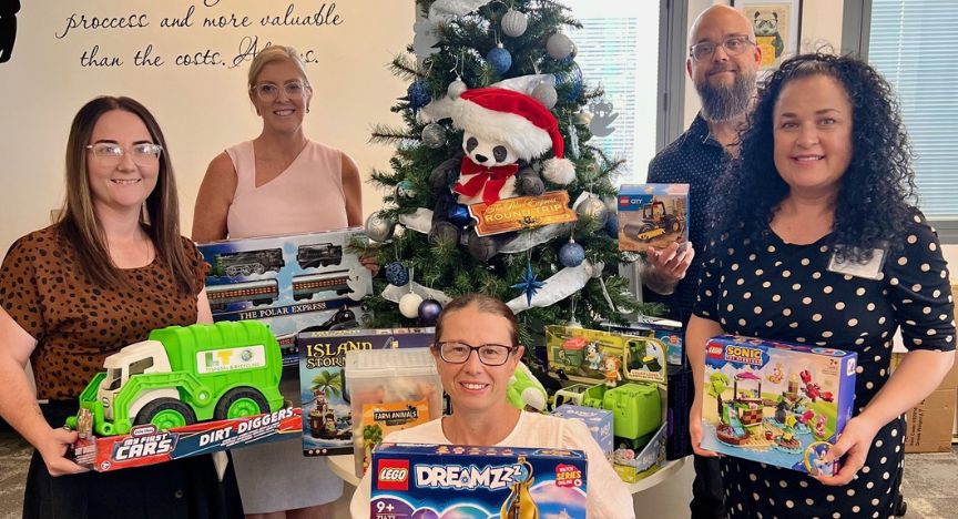 Hospital staff with Christmas toys for children in care 