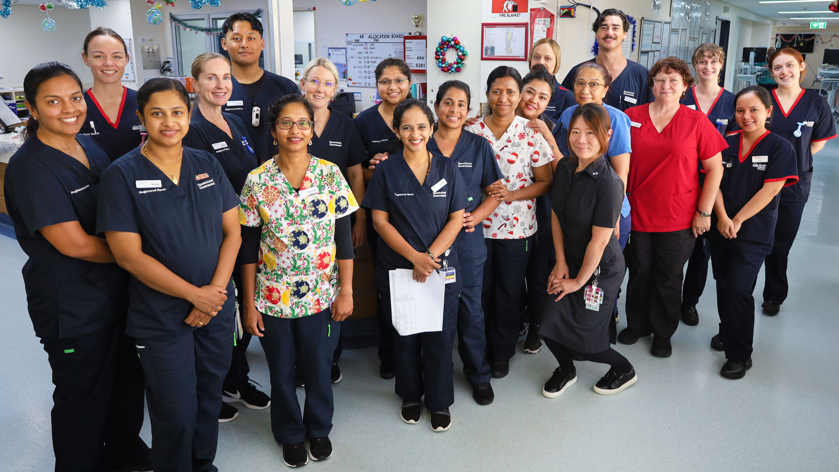 QEII Hospital Ward 4B nursing team standing in Ward smiling