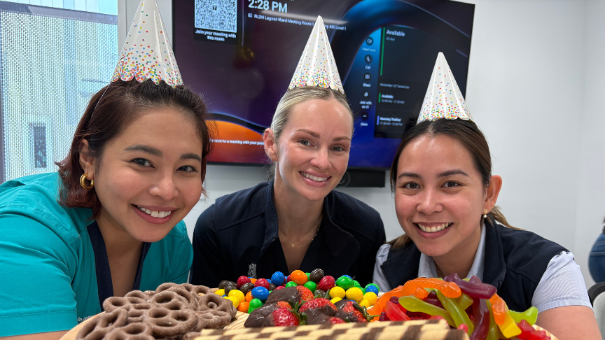 Photograph of staff and birthday spread of lollies