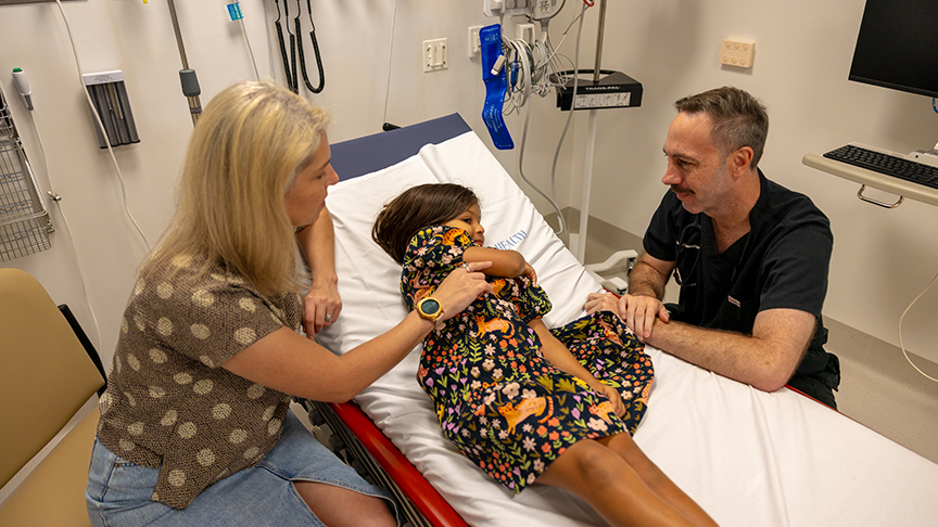 Doctor with a child and mother at Eight Mile Plains Satellite Hospital