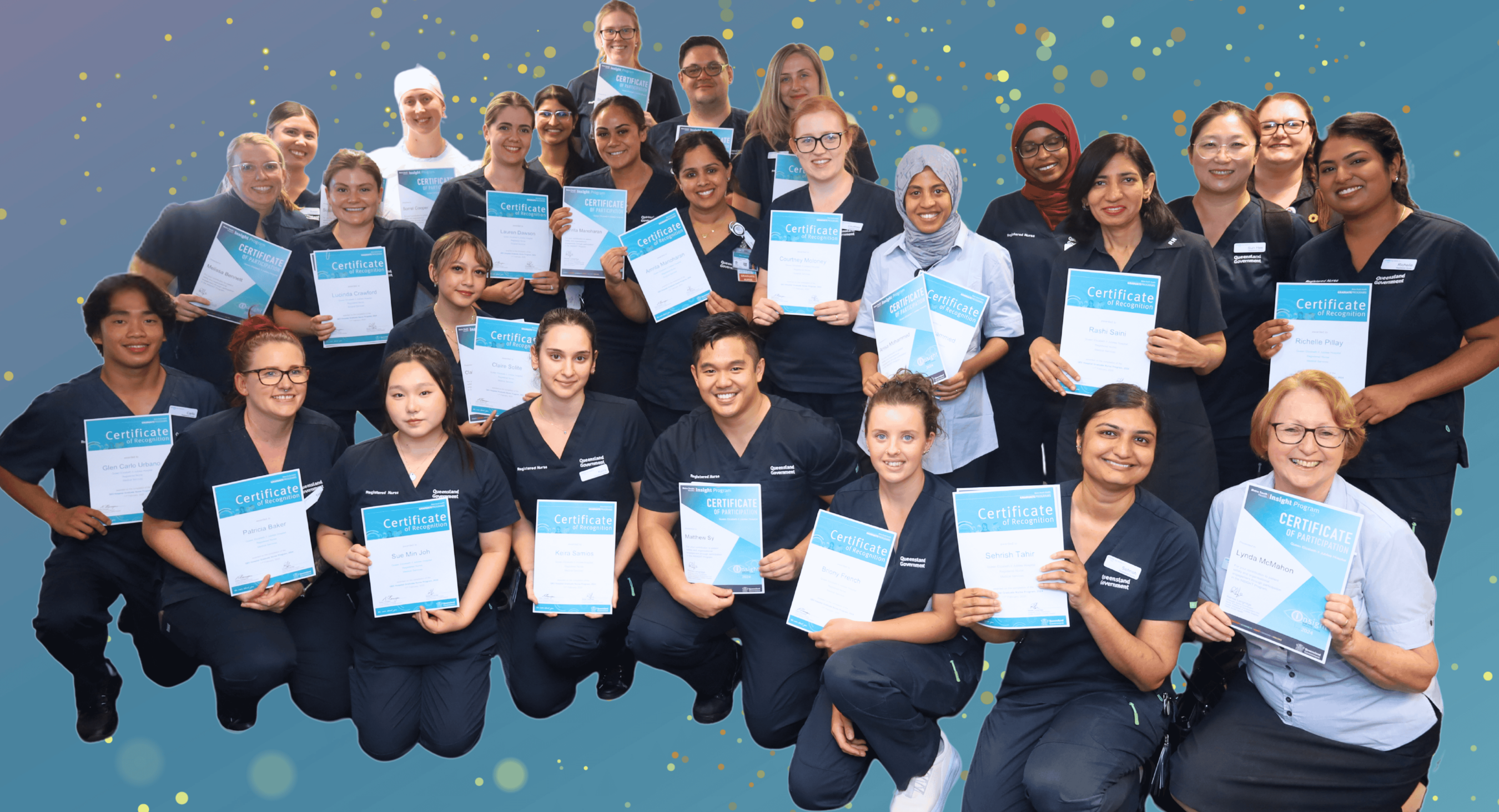 Nursing graduates group holding certificates at QEII Hospital