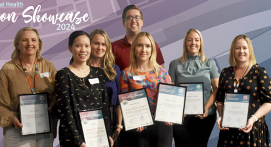 A group of people holding certificates at the Community and Oral Health Innovation Showcase 2024.